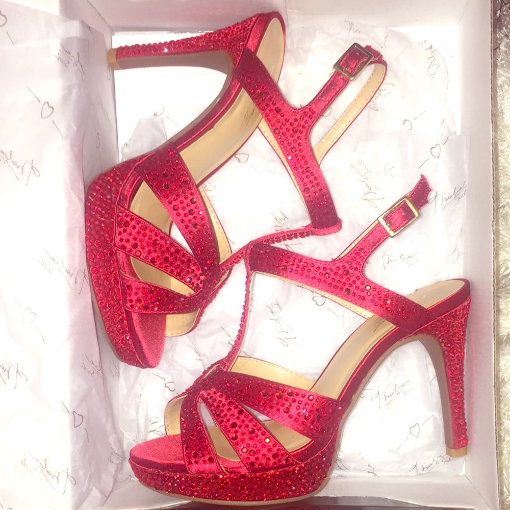 Brand new red heels, never been worn. Size 6.5